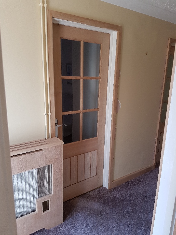 Interior wooden door with glass windows.