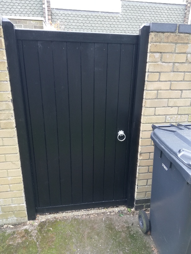 Black wooden garden gate.