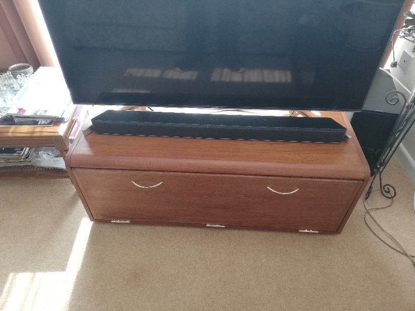 TV stand with storage space inside.