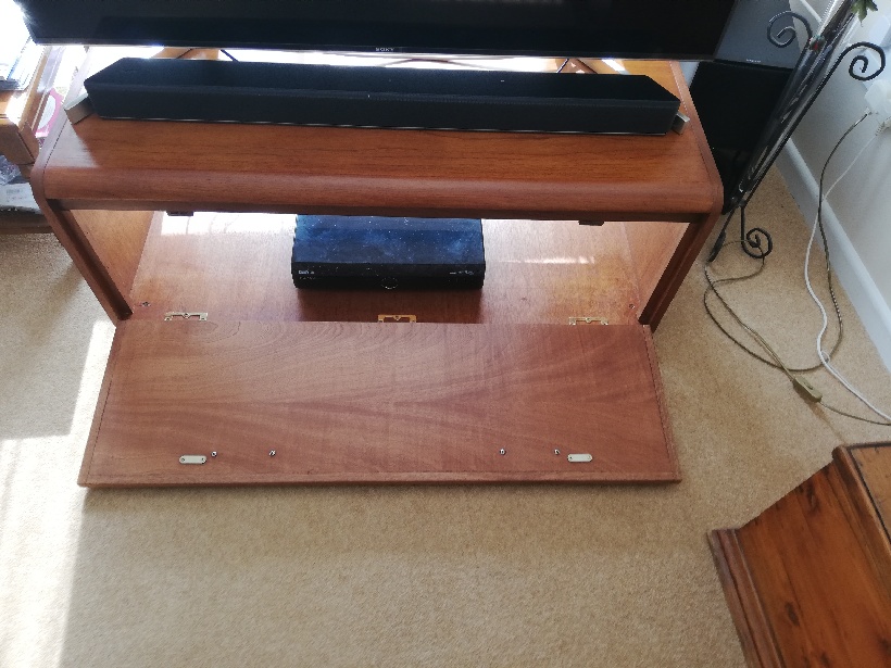 TV stand with storage space inside.